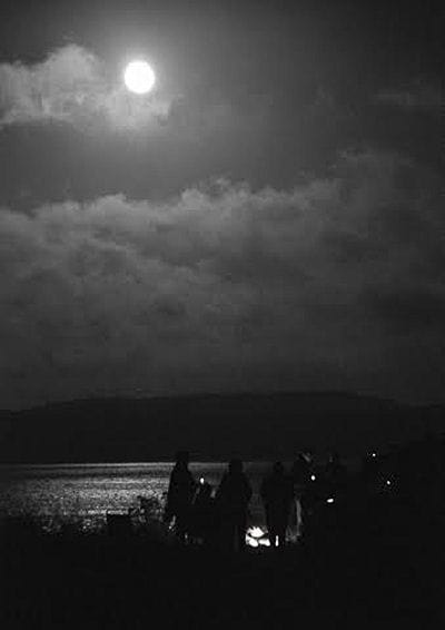 A FULL MOON shines across Western Passage to Split Rock, Sipayik, as Passamaquoddy tribal members participate in a Grandmother Moon Ceremony and a candlelight vigil for survivors of domestic