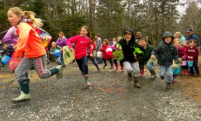 AND THEY'RE OFF -- FINALLY! Youngsters run to collect over 5,000 eggs at Herring Cove Provincial Park during the annual Community Easter Egg Hunt on Campobello. The egg hunt was postponed un