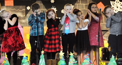 PERFORMING “JOLLY OLD ST. NICHOLAS” are grades 1 and 2 students at the Eastport Elementary School during the Eastport schools’ winter concert on December 18. Along with songs by the elementa