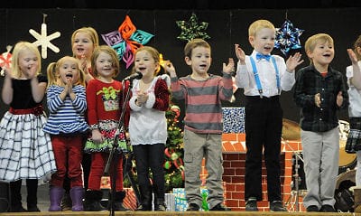 "RING THOSE BELLS!" sing K4 and K5 students at the Eastport Elementary School during the holiday concert on December 14. All of the elementary school grades, along with the Shead High School