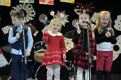 RINGING AND SINGING IN THE HOLIDAYS with“Jingle Bells” are K4 and K5 students at Eastport Elementary School during the school’s holiday concert on December 19. All of the school’s grades, al