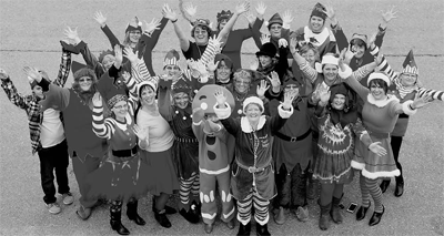 GIVING A CHEER as they get ready to deliver good cheer and bags of goodies to senior citizens in the Eastport area on December 5 is a large group of Eastport elves. (Don Dunbar photo)