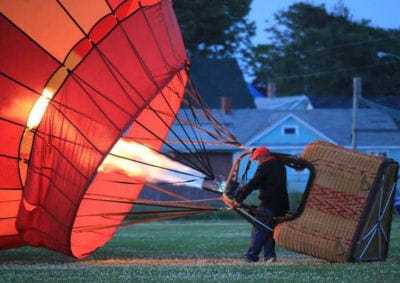 A HOT-AIR BALLOON is readied for take-off by Sunkiss Ballooning owner Todd Monahan during the Lubec Balloon Fest on July 18-20. The tethered balloon rides were sponsored by the Lubec Lions C