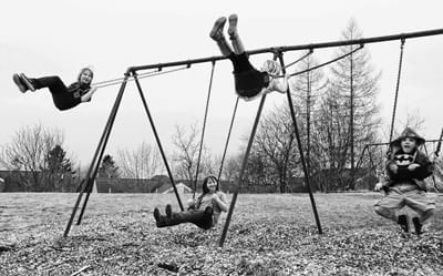 SWINGING HIGH INTO SPRING are (from left) Madison Morrell, Maygin Steadman and Breanna Morrell of Robbinston and Chase Bowen of Eastport. After a long winter, they are enjoying a warm spring