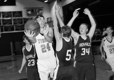 NIC BRADBURY of Shead drives through Jonesport-Beals players to score during a varsity home game on December 20 in Eastport. The Tigers won 67-55 and defeated Jonesport again on January 7. (