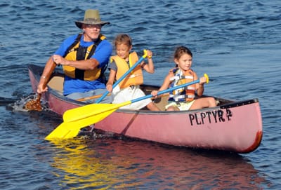 ED BASSETT helps teach youngsters about canoeing during the Passamaquoddy Canoe Cultural Day held on August 2 at Split Rock, Sipayik. (Edward French photo)