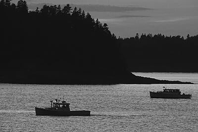 BOATS PASSING IN THE NIGHT off Treat’s Island in Cobscook Bay. (Chessie Crowe photo)