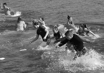 STUDENTS from Shead High School enjoy the water during the Polar Bear Dip on March 8 at Pleasant Point. The event raised $10,540 for Sarah’s House of Maine and the Ronald McDonald House of B