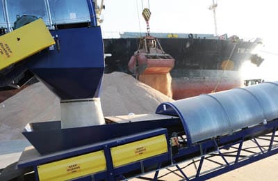 SALT is unloaded on the Estes Head cargo pier at the Port of Eastport by one of the two clamshell buckets on the Star Zeta, before being loaded into the bulk conveyor system in the foregroun