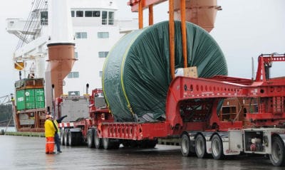 HERE TODAY, GONE TOMORROW. An 87-ton Yankee dryer, bound for Trois-Rivières, Quebec, is hoisted onto the freighter Egmondgracht at the Estes Head port terminal in Eastport on November 21. Th