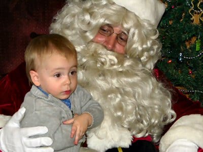 SANTA COMES TO LUBEC, and Aiden Kennedy ponders his Christmas wish list before sharing his thoughts with Ol' Saint Nick. (Chessie Crowe Gartmayer photo)