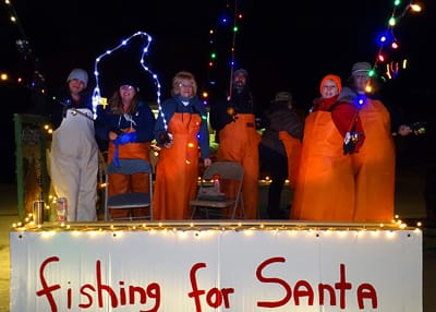 FISHING FOR SANTA are anglers on this float during Lubec’s Festival of Lights parade. The float was sponsored by Dallas Hood and Joanne Case, with the prize money donated to the American Leg