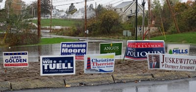 POLITICAL SIGNS of all stripes and colors can be seen at Whiting corner. (Chessie Crowe photo)