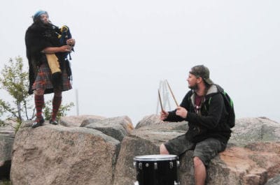 PIPES AND DRUMS. Bagpiper Jesse Macintosh is joined by drummer David Barnes of the Passamaquoddy Tribe, as Scottish and Native American cultures blend in impromptu busking on the Eastport se