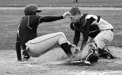 TAGGING OUT a Calais player at home is Shead's John Garnett after a throw from teammate Ryan Bowen to end the baseball game on May 10. Shead won, 1-0. The Tigers have jumped out to a 6-0 rec