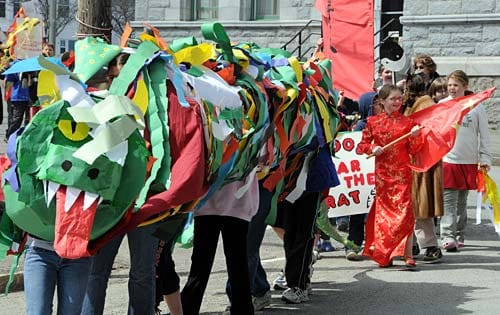 CELEBRATING THE CHINESE NEW YEAR, Eastport Elementary School students parade through downtown Eastport on April 14. They made dragons and face masks for the occasion, which was part of the s