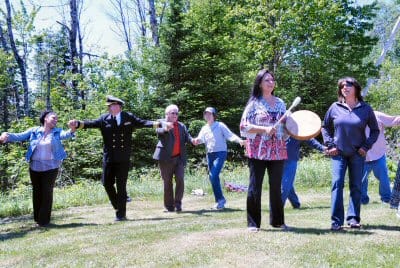 IN JOYFUL CELEBRATION over the restoring of the alewife run to most of the St. Croix River watershed, all attending the homecoming ceremony at the Grand Falls dam on June 5 joined in a Passa