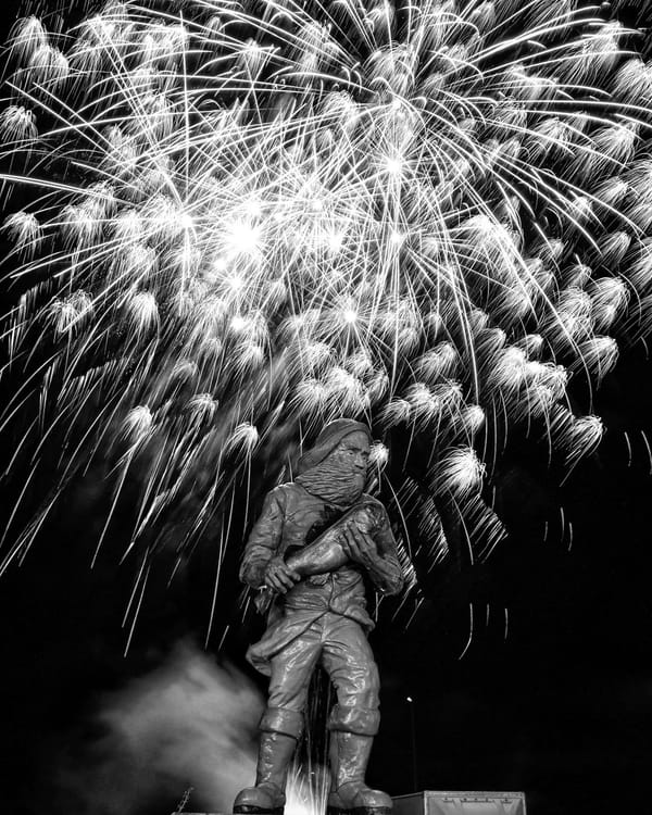 FIREWORKS LIGHT UP THE SKY over the fisherman statue in downtown Eastport during the Pirate Festival. See this issue for coverage of the festival. (Don Dunbar photo)