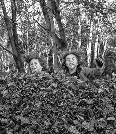 AN AUTUMN RITUAL. Jumping into a large pile of leaves during a recent fall day in Eastport are Ellis Zipperer-Sanchez and Jesse Calame. (Edward French photo) Subscribe to Quoddy Tides Rates: