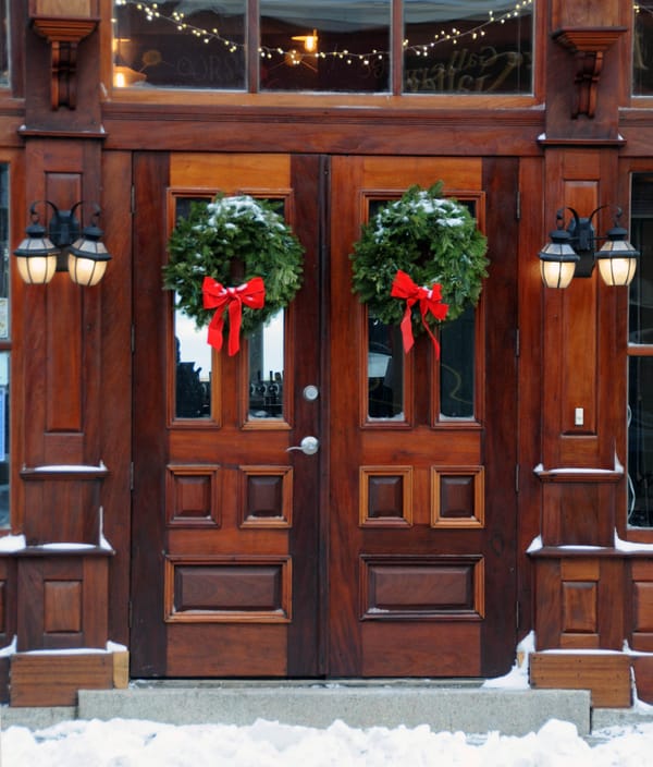 CHRISTMAS WREATHS and holiday lights decorate many downtown businesses in Eastport, including Horn Run Brewing. (Edward French photo)