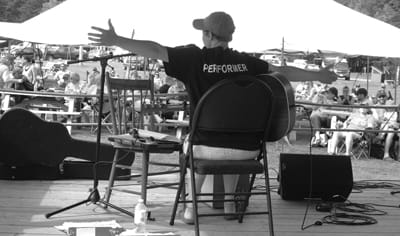 KRISTEN MITCHELL greets the crowd at the main stage at Herring Cove campground during Fogfest on Campobello Island. (J.D. Rule photo)