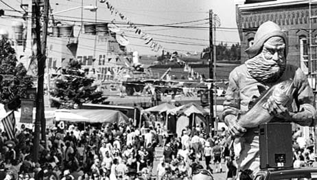 WELCOME TO EASTPORT, where the Grand Independence Day Parade is ended with the return of the fisherman statue.