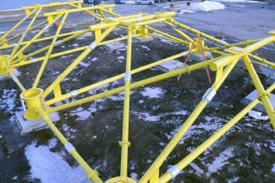 THE NEARLY 100-FOOT-LONG BASE SUPPORT FRAME for Ocean Renewable Power Company's first grid-connected, commercial TidGen Power System is being assembled by Perry Marine & Construction at its 