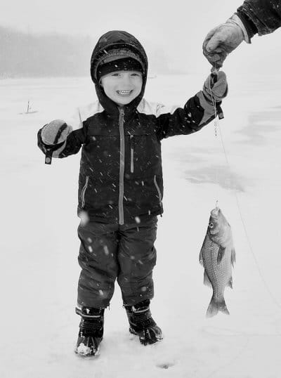 LOOK WHAT I CAUGHT! The Boyden's Lake fishing derby may have been postponed on February 17, but James Mitchell V holds up a white perch caught on that day. The family fun day was rescheduled