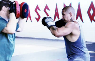 SPARRING in preparation for Jeremy Stevens' August 3 mixed martial arts fight in Biddeford are Stevens (right) of Pleasant Point and his coach, Paul Bernard. (Edward French photo)