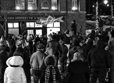 THE GREAT SARDINE is dropped at midnight on New Year's Eve at Bank Square in Eastport, as a crowd watches, bundled up for the cold temperatures. (Don Dunbar photo)