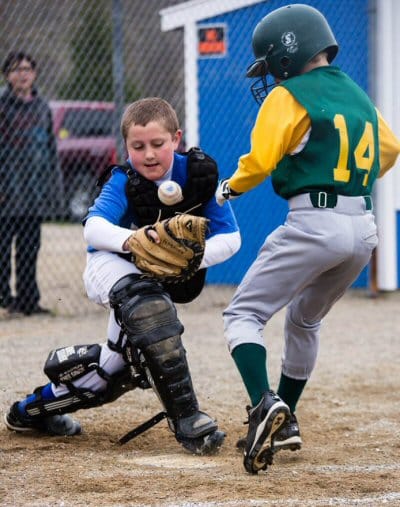 FIELD OF DREAMS. An exciting close play at home plate, during the first game at the new Liberty Hill Field in Pembroke on May 11, featured Devon Wilder of the Pembroke Mets and an Edmunds ru