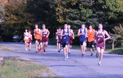OVER HILL, OVER DALE. Runners in the high school boys' cross-country race hosted by Shead High School in Eastport head out on Clark Street on October 15. (Edward French photo) Subscribe to Q