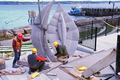 "NATURE'S GRACE," the new granite sculpture made by artist Jim Boyd of Hampton, N.B. (at right), is placed at Sutherland Overlook Park in Eastport on December 4. Eastport was one of the comm