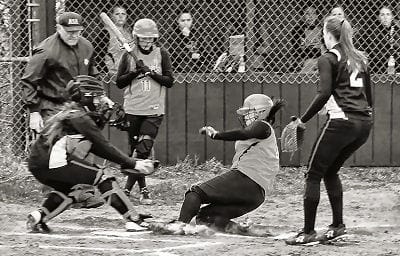 SAFE! Ieishia Mitchell of Shead slides safely into home plate during a May 8 high school softball game against Machias. The Lady Bulldogs defeated the Tigerettes 8-5. (Don Dunbar photo) Subs