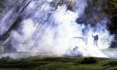 HOLY SMOKE. As the leaves turn and fall, Eastport Cemetery Superintendent Marc Young burns them in piles in the Hillside Cemetery as rays of sunlight stream down on an autumn late afternoon.