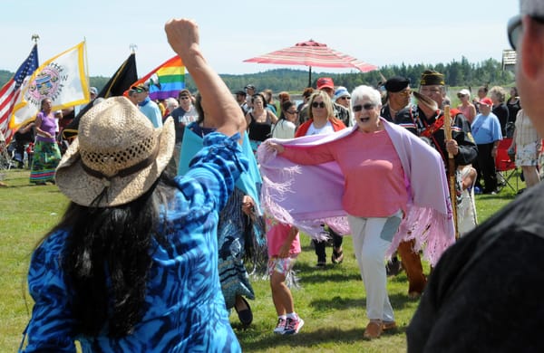 SALUTING veterans, including Madonna Soctomah, a U.S. Navy Medical Corps veteran, during the veterans honor song at the ceremonial dances is former Chief Vera Francis. (Edward French photo)
