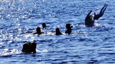 SUN, SWIMMING AND SOMERSAULTS on a sizzling summer's day at Round Pond in Charlotte. (Edward French photo)