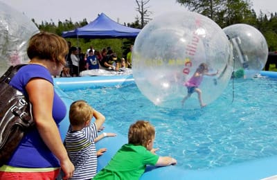 A BIG HIT with youngsters at the recent Grand Manan Rotary Festival were the giant water balls. (Arlene Benham photo) Subscribe to Quoddy TidesRates:$31.65 a year in Washington County, Maine