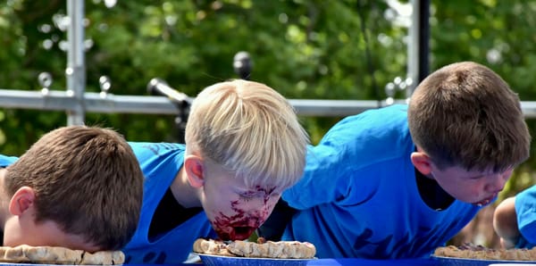 WHAT WOULD A WILD BLUEBERRY FESTIVAL be without the ever-popular blueberry pie-eating contest. This year's event in Machias drew a large crowd as many boys, girls and some adults tried their