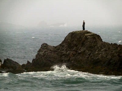 OUTSTANDING on a rock at West Quoddy Head, a young tourist has a bird's-eye-view of the crashing waves from a storm at sea. (Chessie Crowe-Gartmayer)