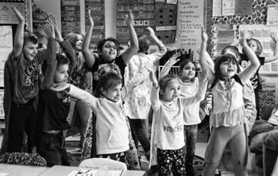 JUMPING FOR JOY, grades 1 and 2 students in Erin Mahar’s class at the Eastport Elementary School celebrate the 100th day of school on February 6. Dressed as superheroes, they defeated Dr. Do