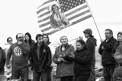 SPEAKING to the crowd during the November 15 event at Pleasant Point in support for water protectors in North Dakota, “From Split Rock to Standing Rock — Water is Life,” is Holly Cleaves. (R