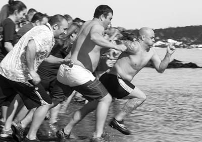 PLUNGING into the frigid water for the Polar Bear Dip on March 6 at Pleasant Point are some brave fundraisers. Sponsored by the Washington County Community College Student Senate, the annual