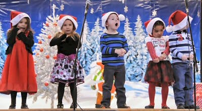 SINGING HIS HEART OUT is one of the K4 students at the Eastport Elementary School during the December 12 winter holiday concert. Along with pieces by the school's bands, chorus and Shead pep