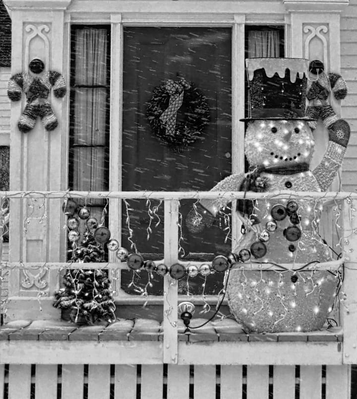 FROSTY THE SNOWMAN greets the first snowfall from his Washington Street home in Eastport. (Don Dunbar photo)