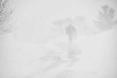 CLIMBING FORT HILL, a walker heads into a white-out during the January 31 snowstorm in Eastport. (Edward French photo)