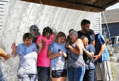 STAYING COOL and getting wet for a good cause on a hot August day are personnel from Federal Marine Terminals, Northeastern Longshoremen's Association and the City of Eastport who responded