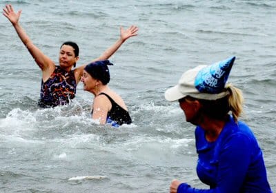 TAKING A NEW YEAR'S DIP to benefit the Senior Fuel Fund are some Lubec residents. (J.D. Rule photo)