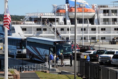 PASSENGERS ON THE PEARL MIST board buses for a tour of the Eastport area. The 325-foot cruise ship tied up to the Eastport breakwater for a visit on September 24. (Edward French photo)