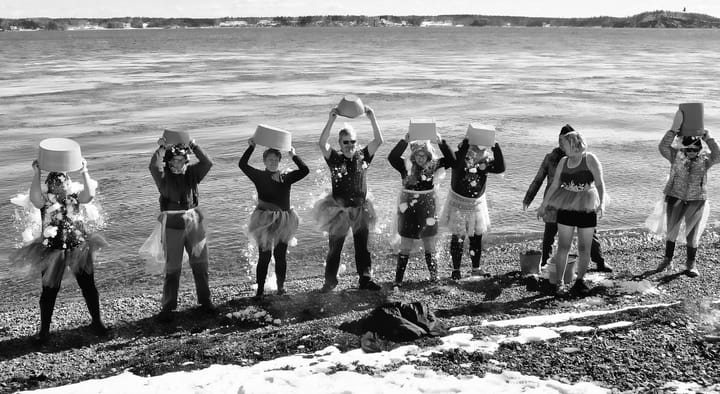 DUMPING BUCKETS OF SNOW over their heads are a group of nine polar bear 'dippers' gathered at a small beach in Eastport's South End on March 5. They were there to support the Ronald McDonald